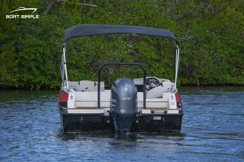 Slide: The Image of 2023 Starcraft SVX 210 OB boat with outboard motor on water. - 4