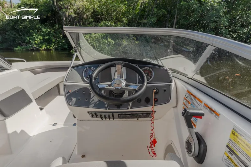 Slide: The Image of 2022 Hurricane 217 SD boat dashboard and steering wheel, interior view. - 7