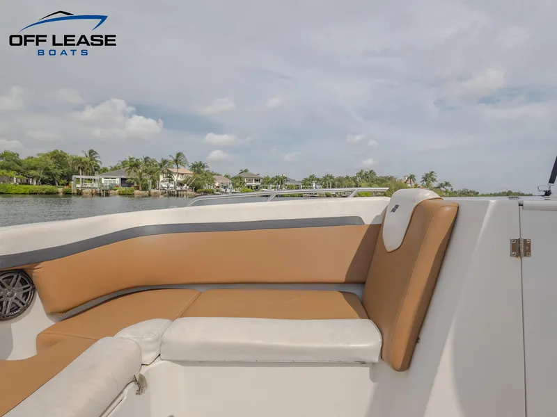 Slide: The Image of 2021 Starcraft SVX 231 OB boat interior with tan and white seating. - 5