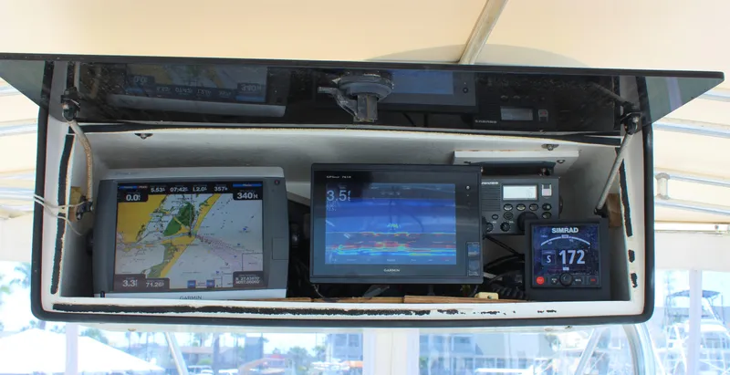 Slide: The Image of 1980 Bertram Sport Fisherman boat navigation and fish-finding equipment. - 10