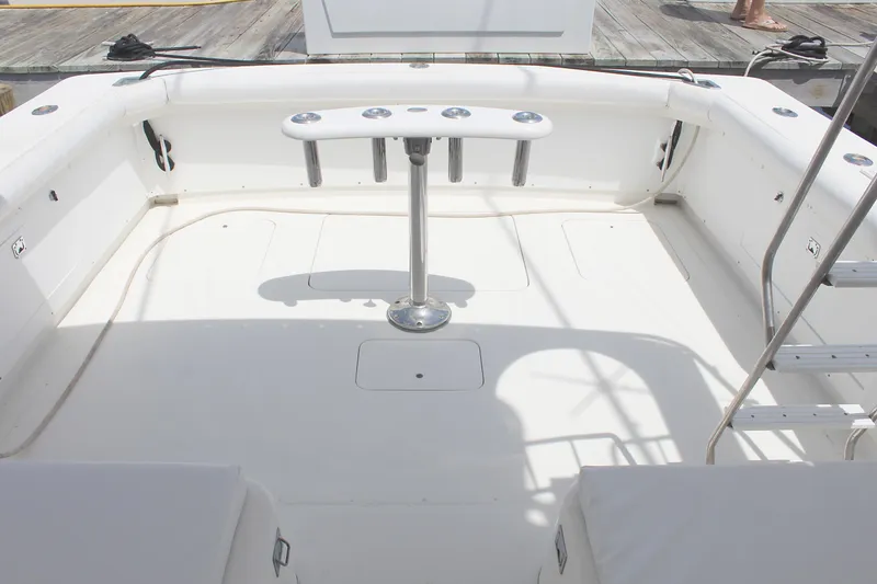 Slide: The Image of 1980 Bertram Sport Fisherman boat deck with rod holders and seating. - 11