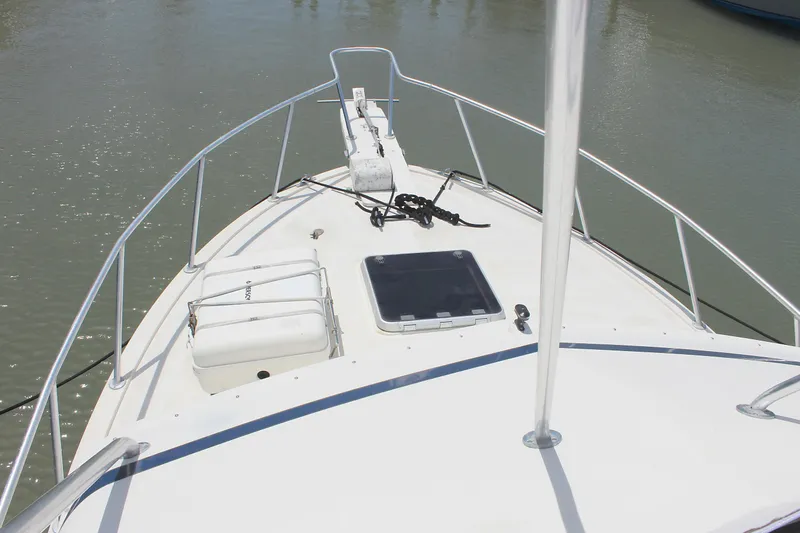 Slide: The Image of 1980 Bertram Sport Fisherman boat bow with anchor and hatch. - 17