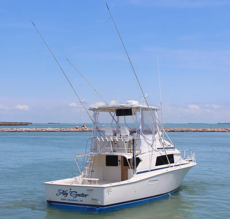 Slide: The Image of 1980 Bertram Sport Fisherman boat on calm waters. - 2