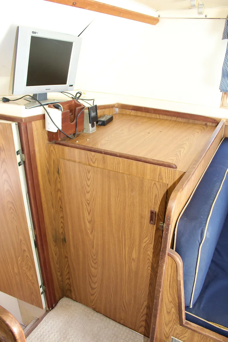 Slide: The Image of 1980 Bertram Sport Fisherman interior with TV and wooden cabinetry. - 21