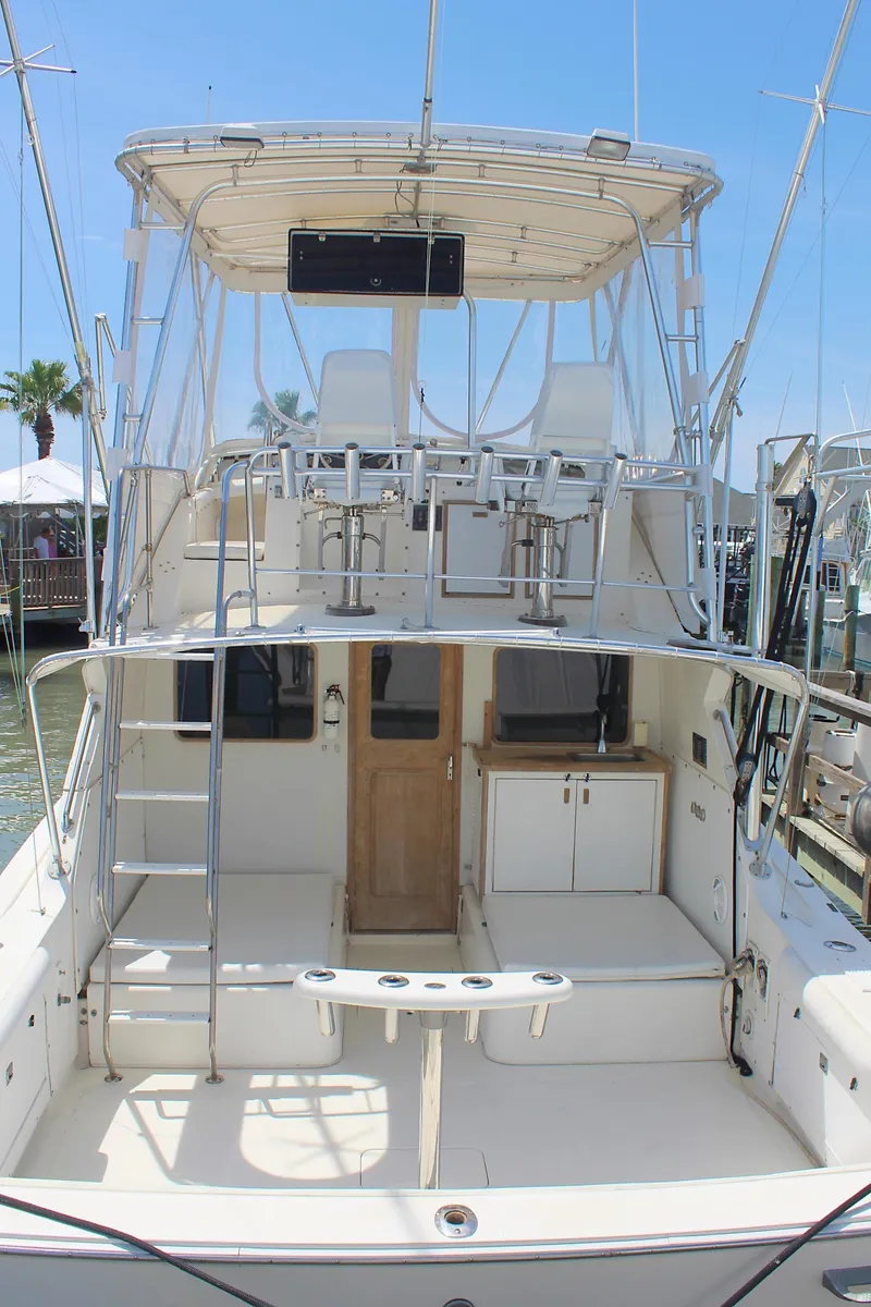 Slide: The Image of 1980 Bertram Sport Fisherman boat with flybridge and spacious deck. - 5