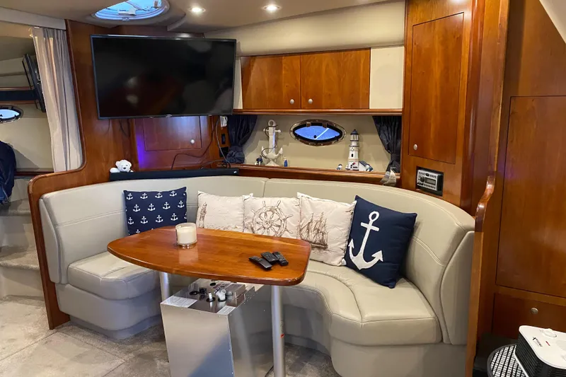 Slide: The Image of Luxurious 2006 Cruisers Yachts 370 Express interior with elegant seating and nautical decor. - 14