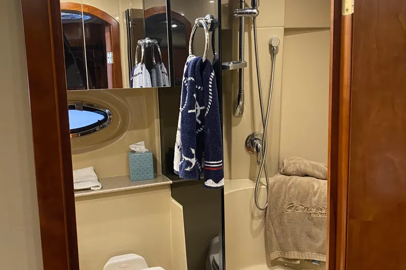 Slide: The Image of Bathroom interior of 2006 Cruisers Yachts 370 Express with shower and nautical decor. - 24