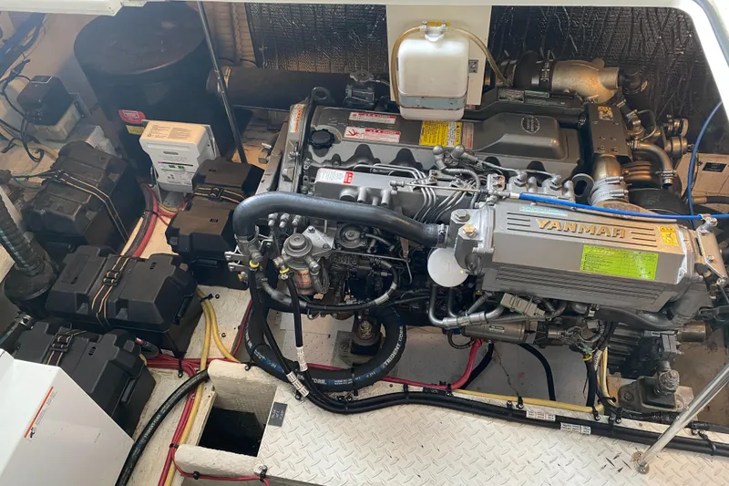 Slide: The Image of Engine room of 2006 Cruisers Yachts 370 Express, showcasing detailed mechanical components. - 31