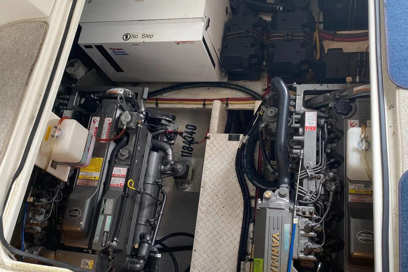 Slide: The Image of Engine compartment of 2006 Cruisers Yachts 370 Express, showcasing dual engines and generator. - 32