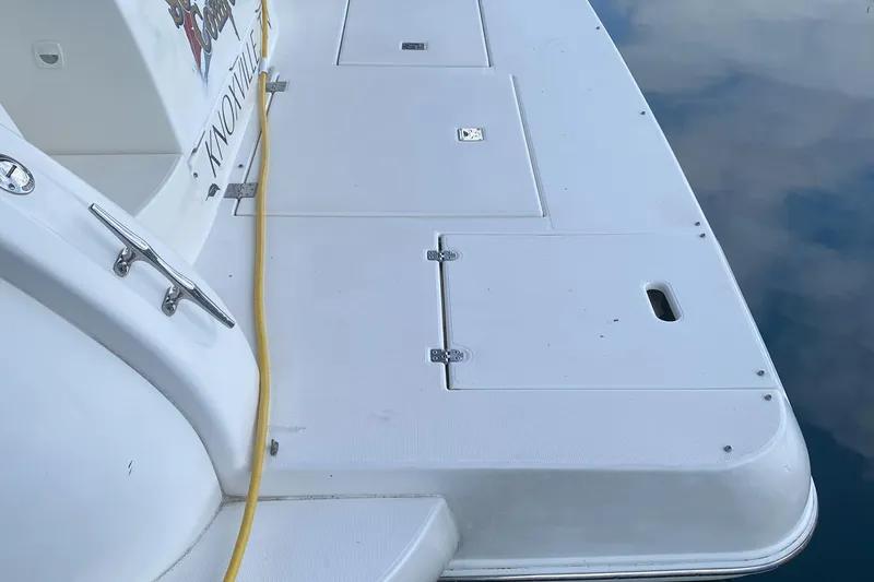 Slide: The Image of 2006 Cruisers Yachts 370 Express swim platform with storage hatches and yellow power cable. - 41