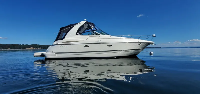 The Image of 2006 Cruisers Yachts 370 Express on calm water under clear blue sky. - 0