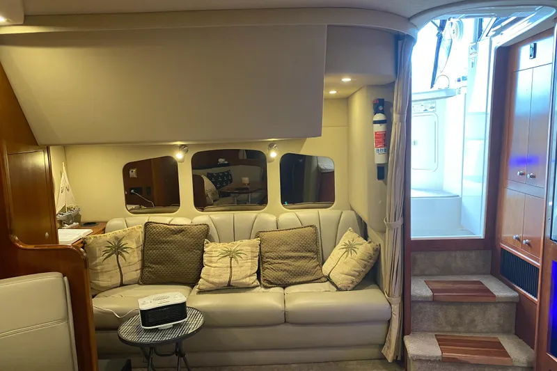 Slide: The Image of Interior of 2006 Cruisers Yachts 370 Express with cozy seating and elegant decor. - 15