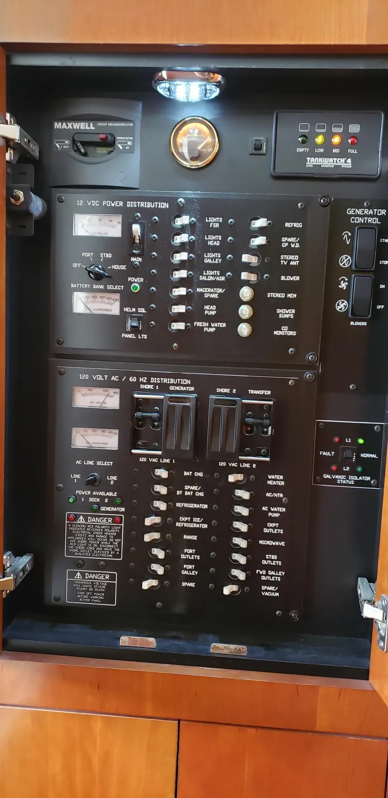 Slide: The Image of Electrical panel of 2006 Cruisers Yachts 370 Express with various switches and controls. - 23
