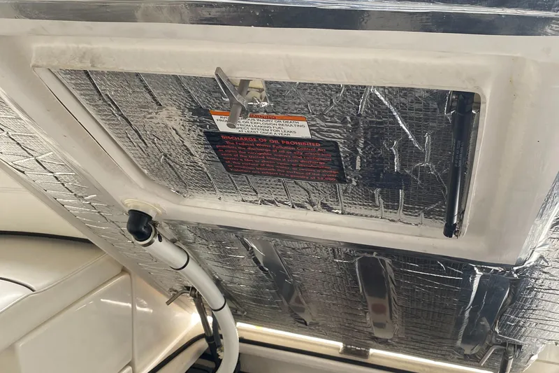 Slide: The Image of 2006 Cruisers Yachts 370 Express engine compartment with insulation and hydraulic lift. - 28