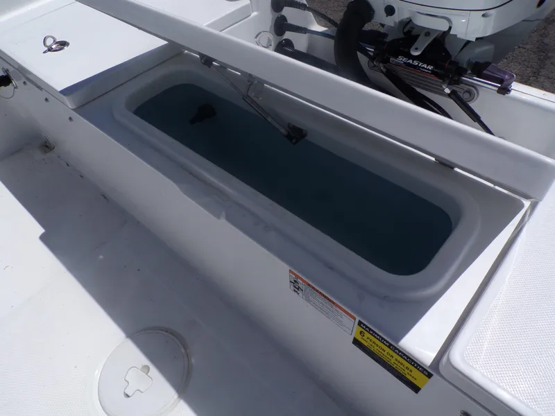 Slide: The Image of 2024 Savannah 210X boat livewell and storage compartment. - 15