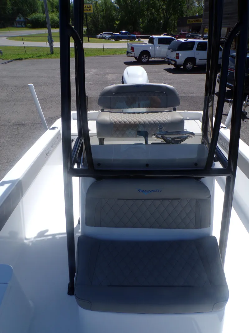 Slide: The Image of 2024 Savannah 210X boat interior with seating and console. - 18