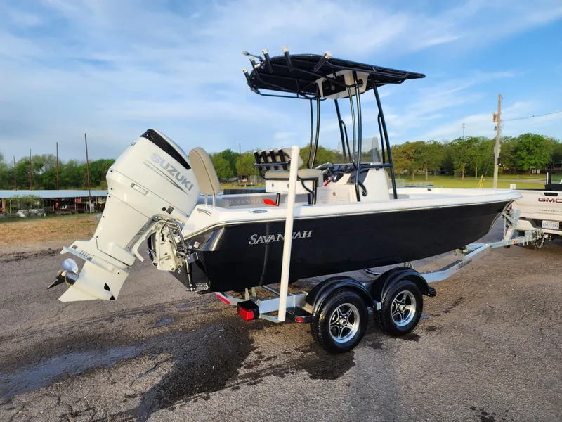 Slide: The Image of 2024 Savannah 210X boat on trailer with Suzuki outboard motor. - 26