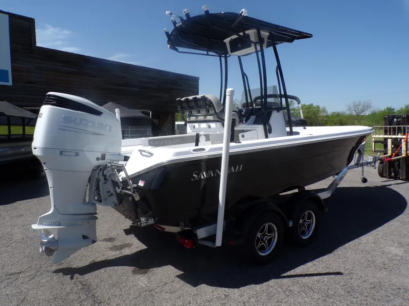 Slide: The Image of 2024 Savannah 210X boat on trailer with Suzuki outboard motor. - 3