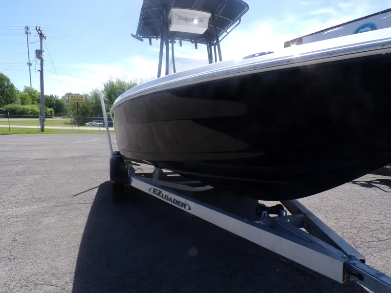 Slide: The Image of 2024 Savannah 210X boat on EZ Loader trailer in outdoor setting. - 4