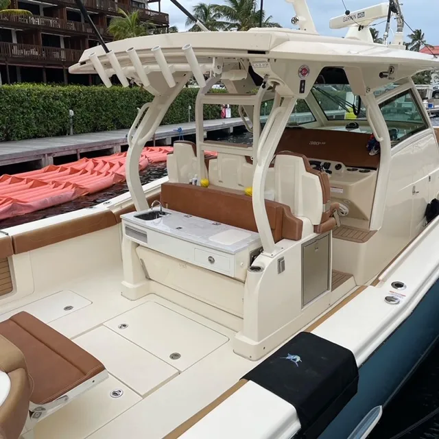 Slide: The Image of 2018 Scout 380 LXF boat interior with seating and helm station. - 2