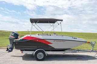 Slide: The Image of 2022 Starcraft SVX 171 OB boat on a trailer with a bimini top. - 1