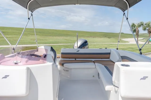 Slide: The Image of 2022 Starcraft SVX 171 OB boat interior with seating and canopy. - 14