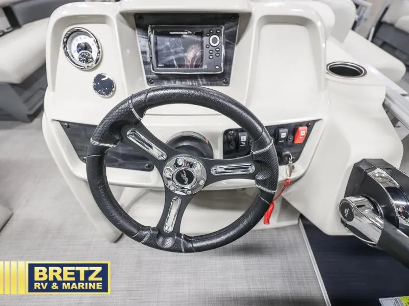 Slide: The Image of Steering console of 2024 Vista Fish 20 boat with controls and gauges. - 12