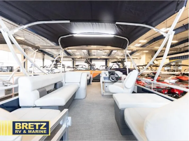 Slide: The Image of 2024 Vista Fish 20 pontoon boat interior at Bretz RV & Marine showroom. - 14