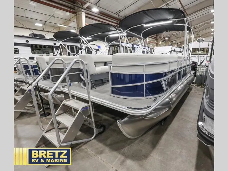 Slide: The Image of 2024 Vista Fish 20 pontoon boat displayed indoors at Bretz RV & Marine showroom. - 4
