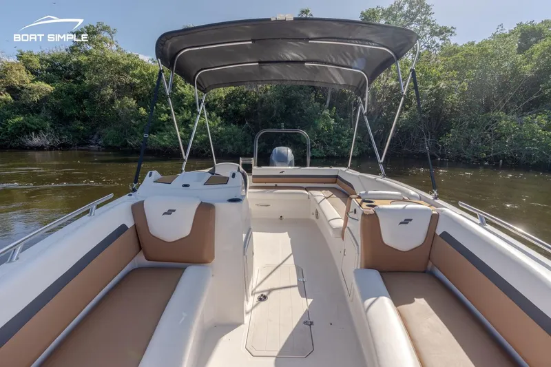 Slide: The Image of 2022 Starcraft SVX 191 OB boat interior with seating and canopy. - 9