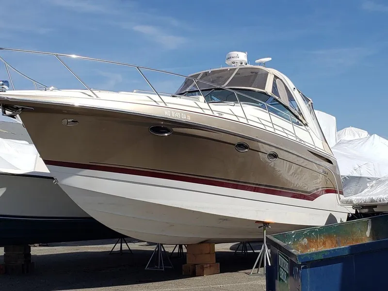 The Image of 2012 Formula 34 Cruiser boat on dry dock under clear blue sky. - 0