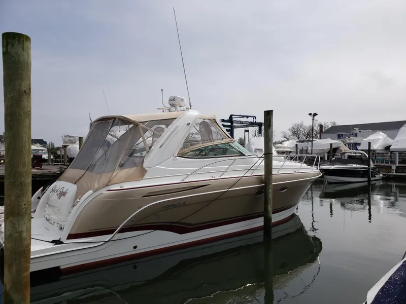 Slide: The Image of 2012 Formula 34 Cruiser docked at a marina. - 1