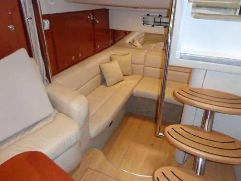 Slide: The Image of Interior of 2012 Formula 34 Cruiser with beige leather seating and wooden accents. - 14