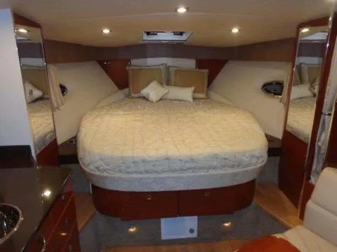 Slide: The Image of Luxurious bedroom interior of a 2012 Formula 34 Cruiser yacht with a large bed. - 15