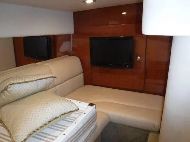 Slide: The Image of Interior cabin of 2012 Formula 34 Cruiser with TV and beige seating. - 17
