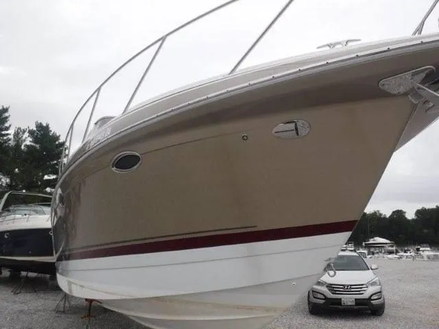 Slide: The Image of 2012 Formula 34 Cruiser boat on display in a marina. - 3