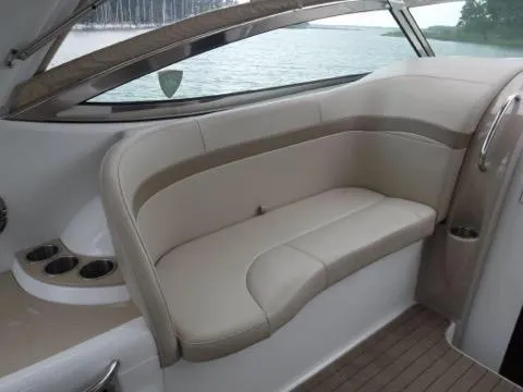Slide: The Image of 2012 Formula 34 Cruiser interior seating with beige upholstery and cup holders. - 7