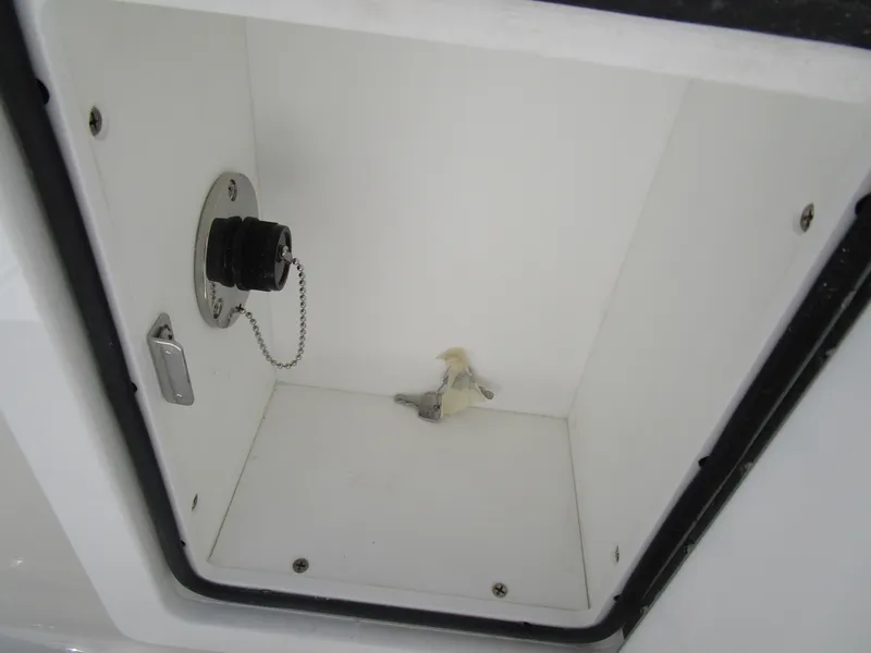 Slide: The Image of Storage compartment of 2024 Ranger 2660 Bay boat with a fuel cap. - 12