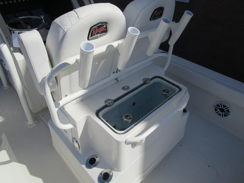 Slide: The Image of 2024 Ranger 2660 Bay boat interior with rod holders and livewell. - 13