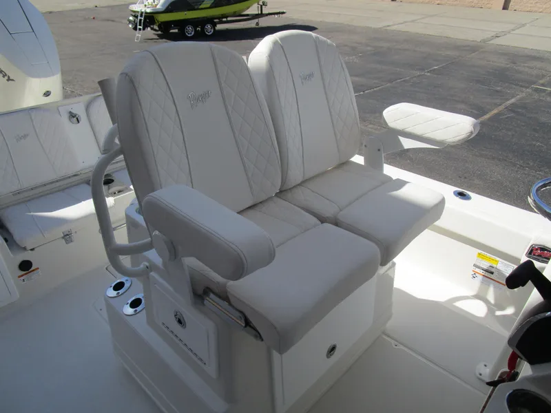 Slide: The Image of 2024 Ranger 2660 Bay boat with dual white cushioned seats. - 15