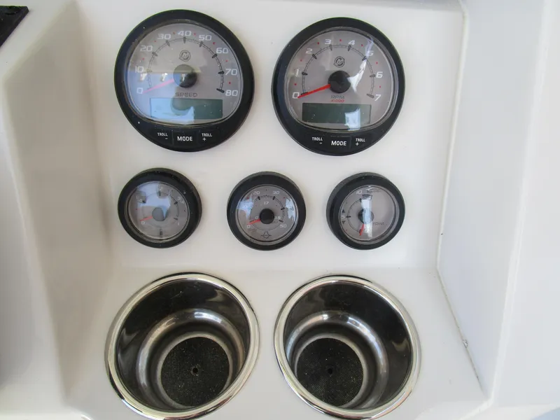 Slide: The Image of Dashboard of 2024 Ranger 2660 Bay boat with gauges and cup holders. - 19