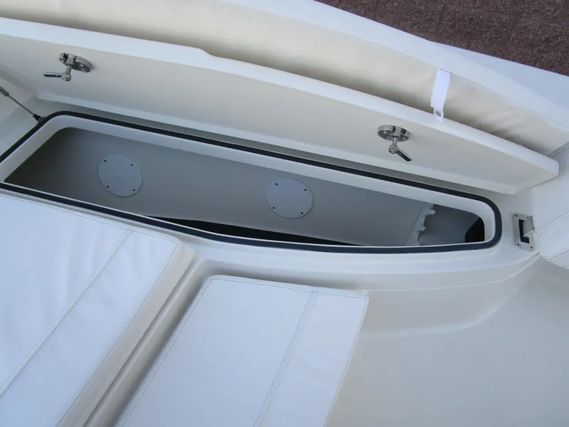 Slide: The Image of 2024 Ranger 2660 Bay boat storage compartment with cushioned seating. - 26