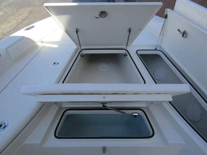 Slide: The Image of 2024 Ranger 2660 Bay boat storage compartments open. - 28