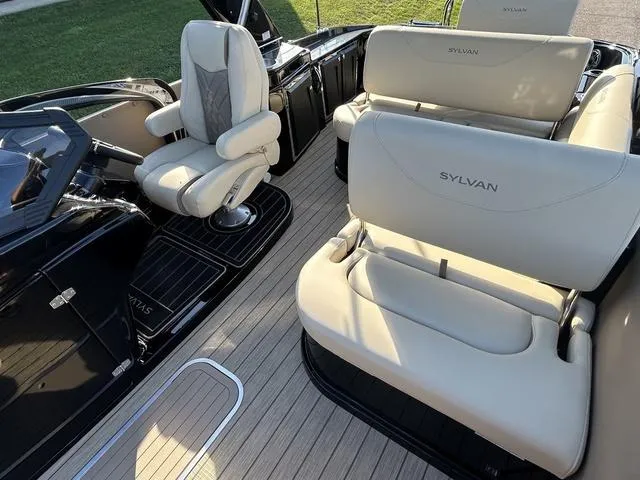 Slide: The Image of 2024 Sylvan M3 DLZ boat interior with luxurious seating and modern design. - 16