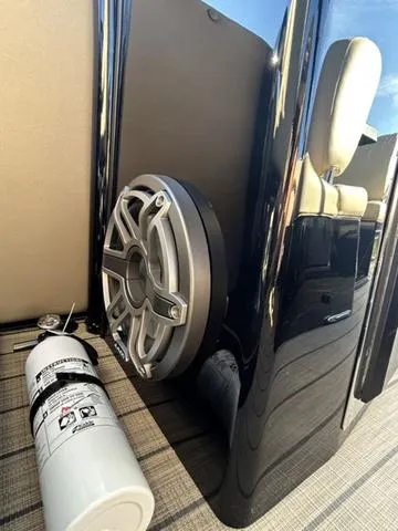 Slide: The Image of 2024 Sylvan M3 DLZ boat interior with speaker and fire extinguisher. - 24