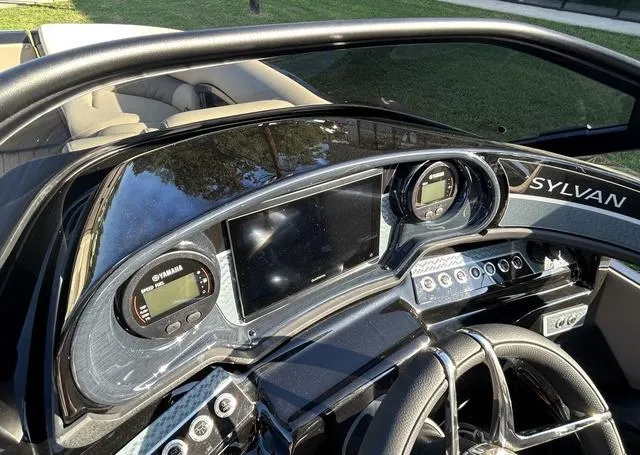 Slide: The Image of 2024 Sylvan M3 DLZ boat dashboard with Yamaha controls and digital display. - 26