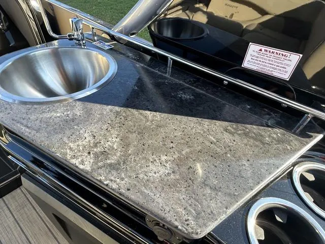 Slide: The Image of 2024 Sylvan M3 DLZ boat kitchen sink and countertop. - 31