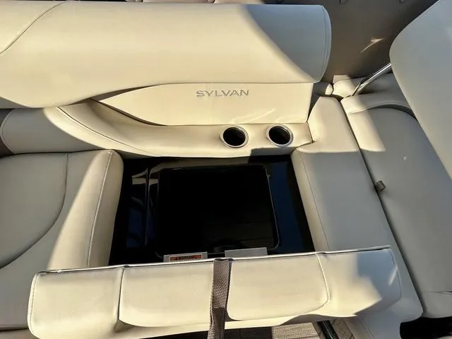 Slide: The Image of 2024 Sylvan M3 DLZ boat interior with beige seating and cup holders. - 37