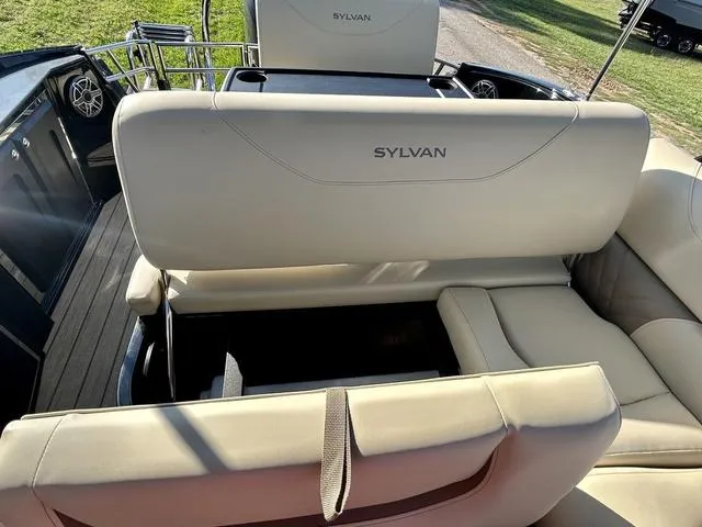 Slide: The Image of 2024 Sylvan M3 DLZ boat interior with beige seating and modern design. - 38