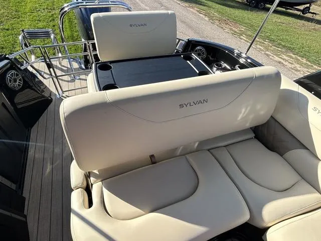 Slide: The Image of 2024 Sylvan M3 DLZ boat with luxurious seating and table setup. - 40